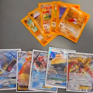 15 year old Pokémon cards and 2 GX 1 Vmax and Blissey tin And mystery card